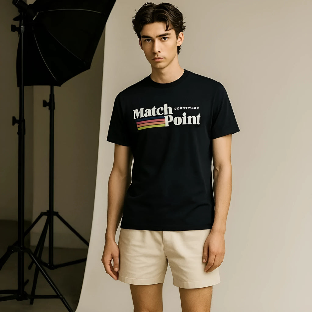 Man wearing a black t-shirt with a detailed 3D digital printed pattern on the front.