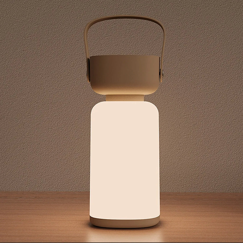 Portable LED camping lantern with USB charging, waterproof design, available in blue or brown, compact modern style.