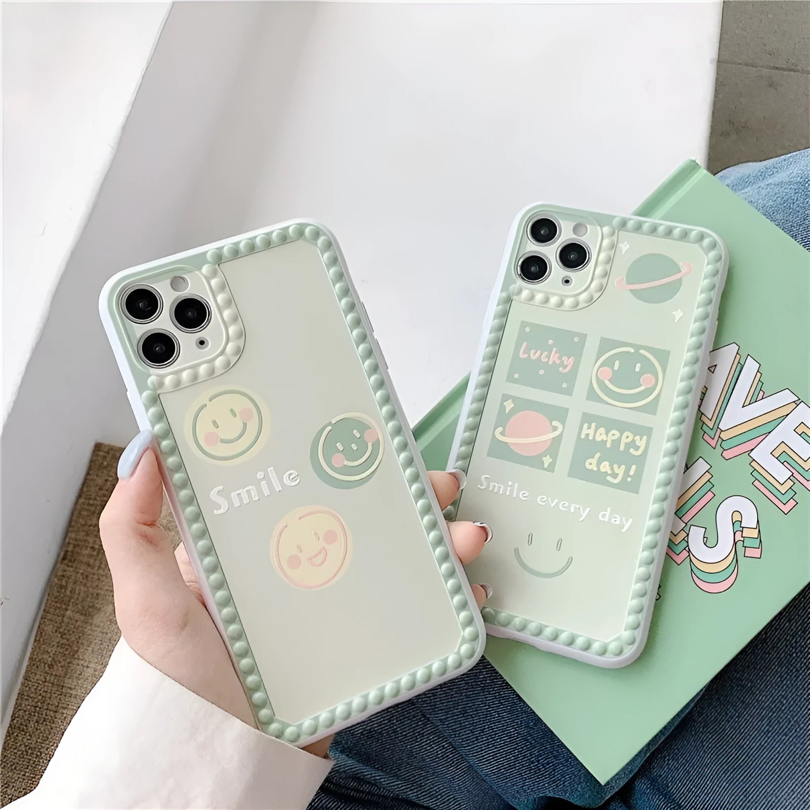Green TPU iPhone back cover case with geometric smiley face and polka dot frame design.