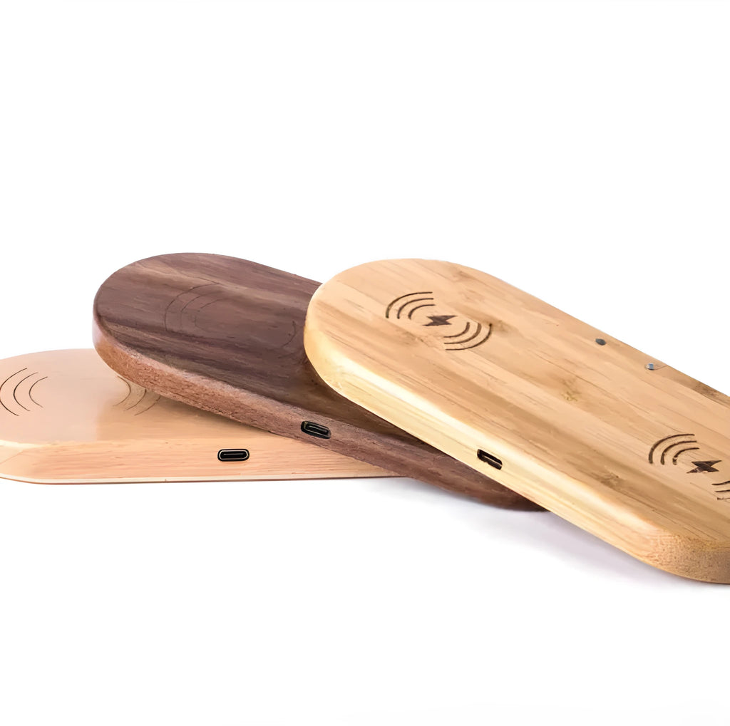 Wood wireless charger with natural bamboo finish showing Qi smartphone charging on top