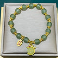 Handcrafted glass and coloured glaze bracelet with rabbit charm in national style design