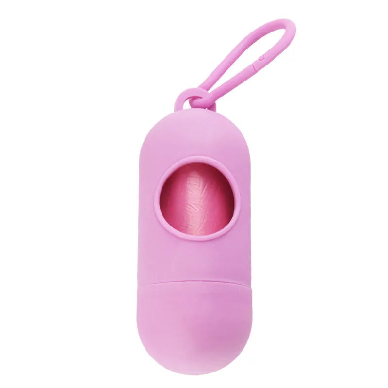 A black rectangular dog poop bag holder with a side metal hook and a grey Velcro strap, showing its compact size.