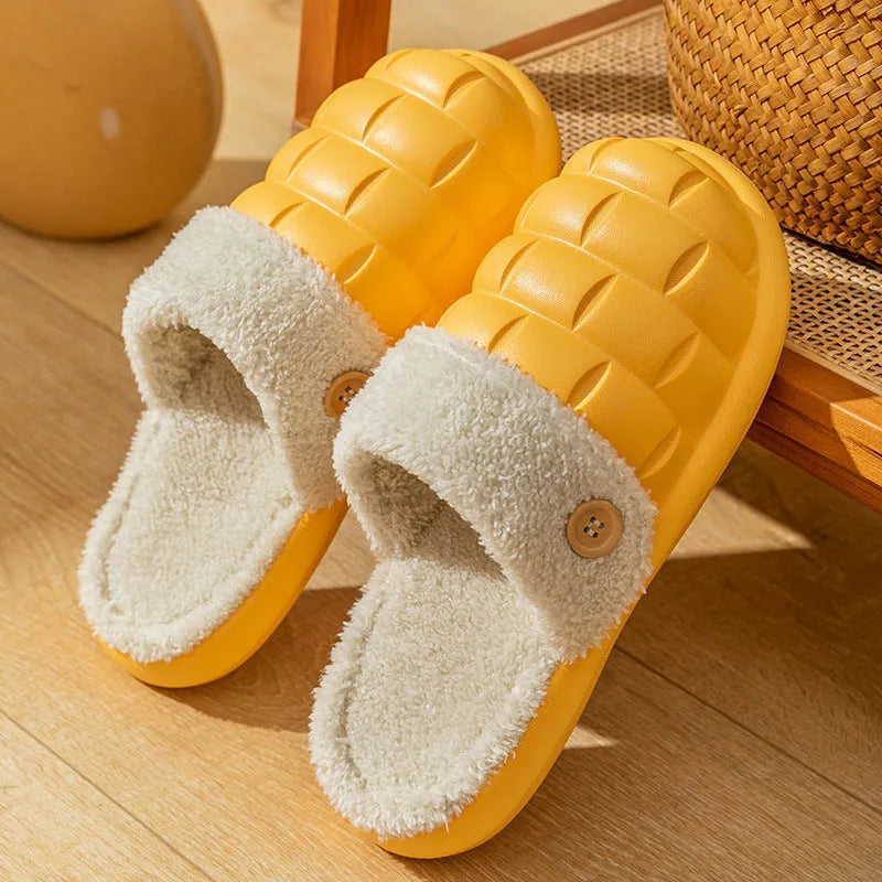 Plaid detachable EVA slippers with plush lining in pink, shown on a foot.