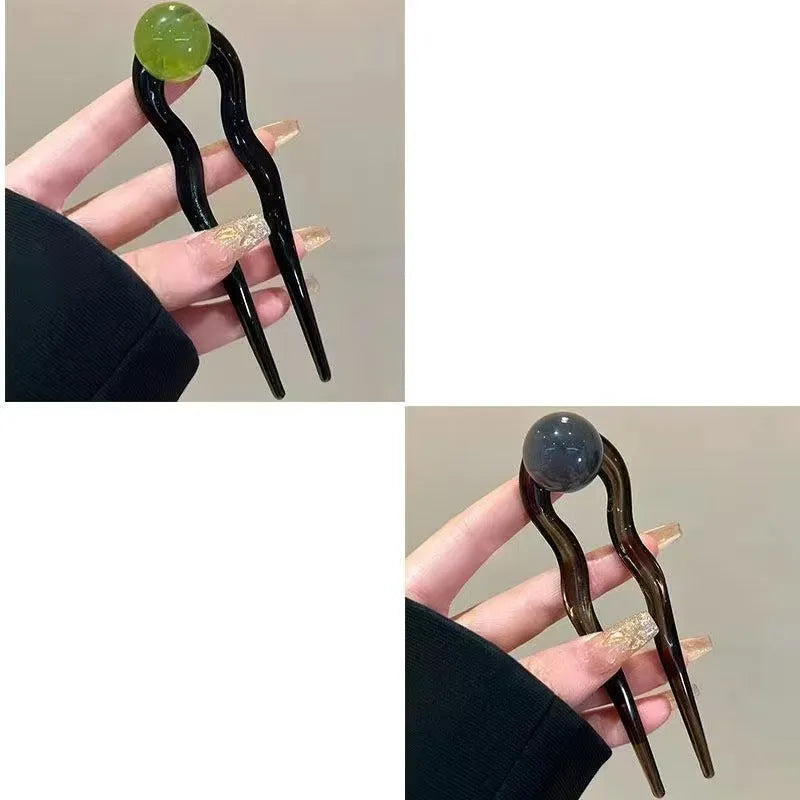 U-shaped acrylic hair barrettes with ball retro design in beige, caramel, dark gray and green colours