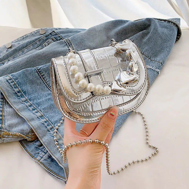 Women's PU leather mini tote crossbody bag in saddle silhouette with single shoulder strap