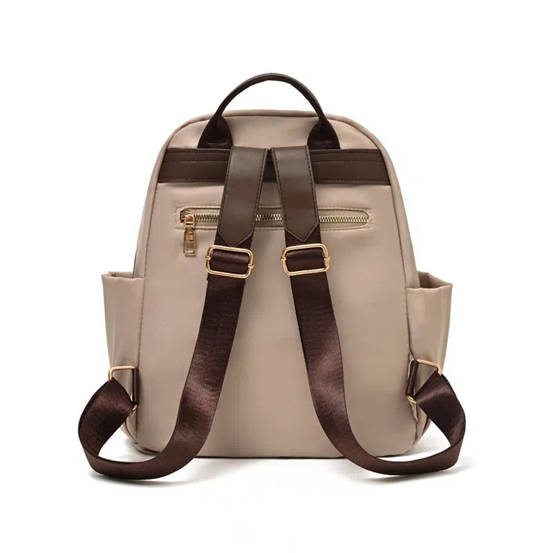 Women's large-capacity nylon travel backpack in black or milk tea colour with polyester lining and internal patch pocket.