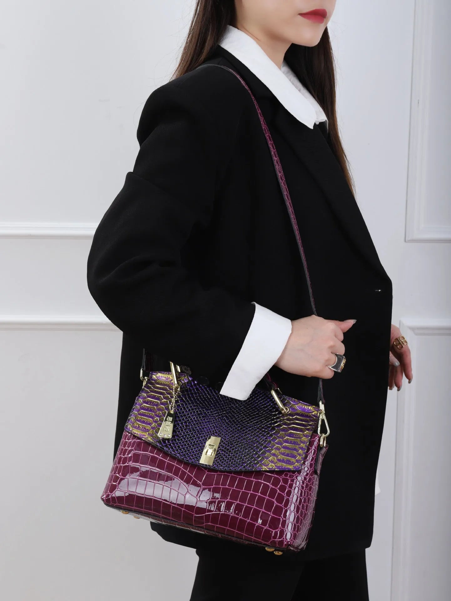 Women's structured crossbody handbag in colourful crocodile pattern with double shoulder straps and organisational compartments