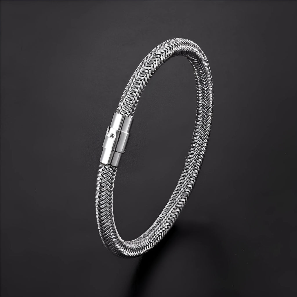Geometric titanium steel bracelet with magnetic clasp shown on a wrist, demonstrating its unisex boyfriend style.