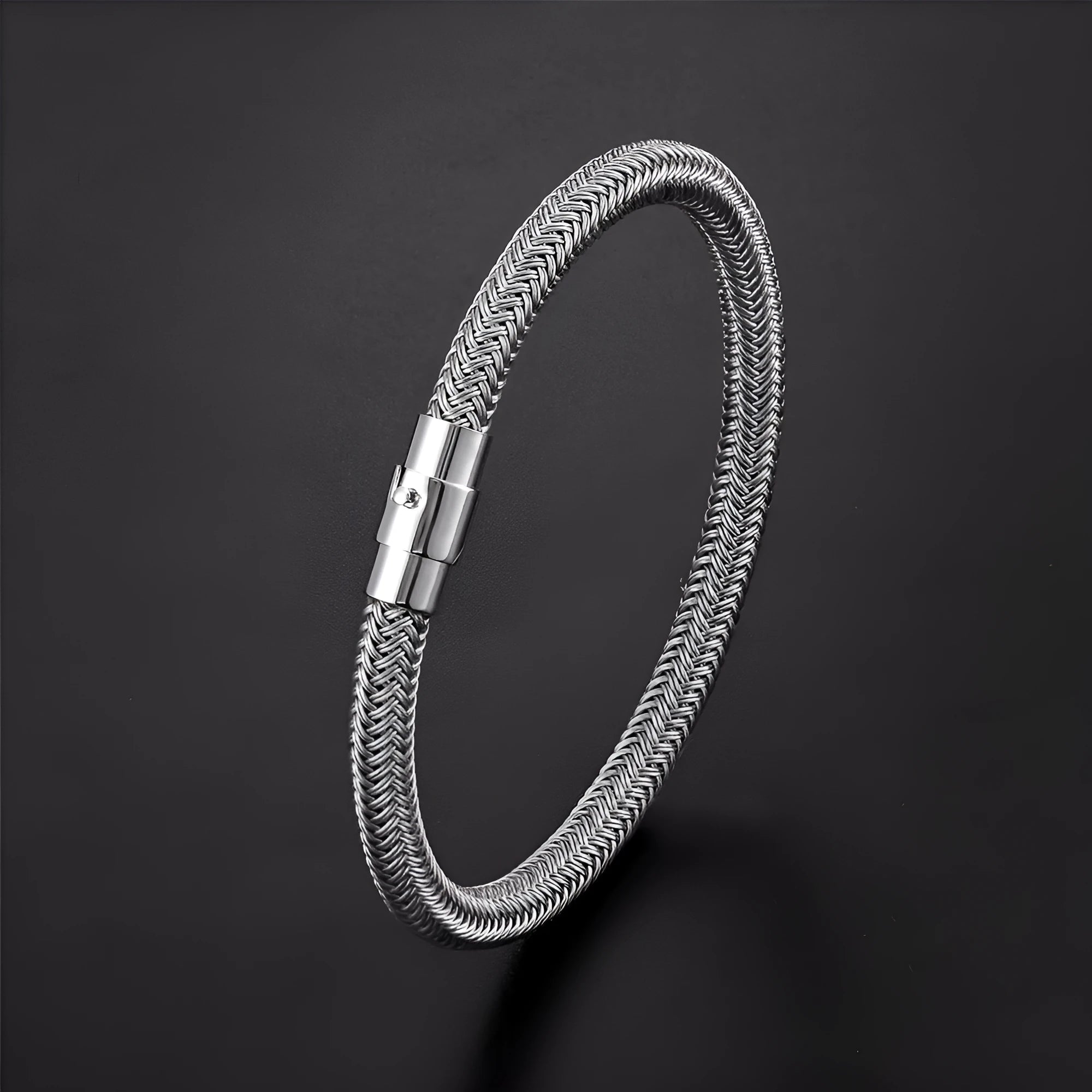 Geometric titanium steel bracelet with magnetic clasp shown on a wrist, demonstrating its unisex boyfriend style.