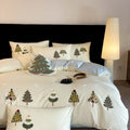 Cream blue duvet cover with raised towel embroidery Christmas tree design, part of a pure cotton four-piece bedding set.