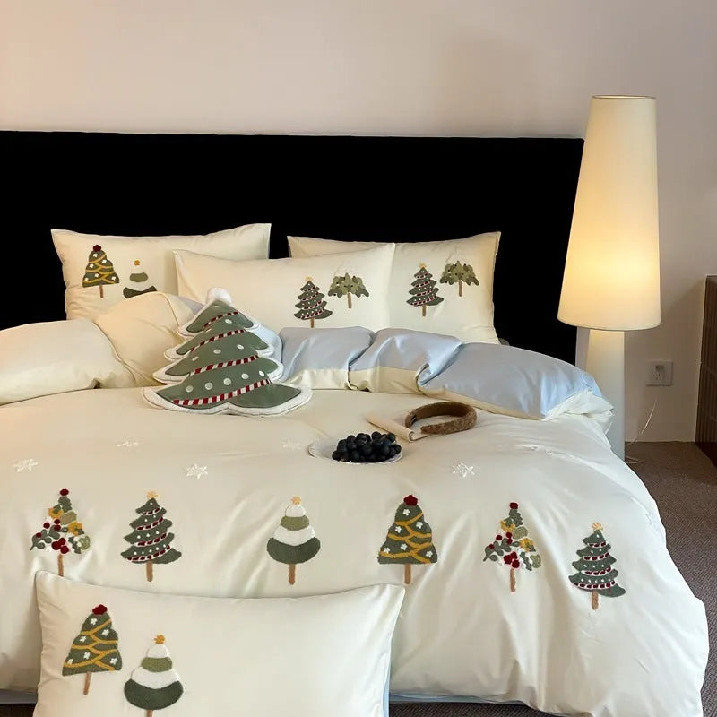 Cream blue duvet cover with raised towel embroidery Christmas tree design, part of a pure cotton four-piece bedding set.