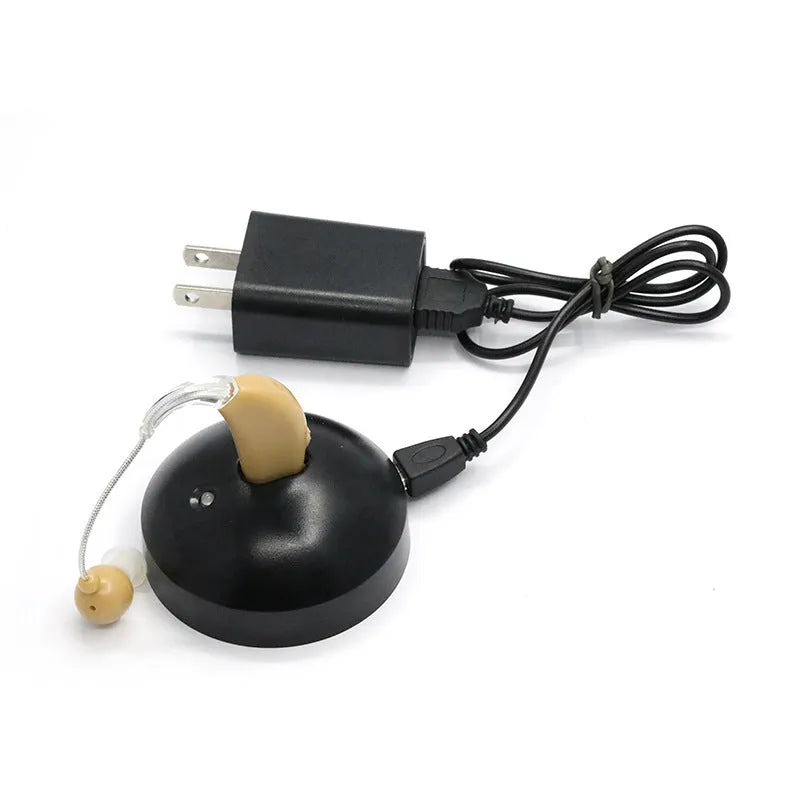 Black rechargeable hearing aid amplifier with silicone ear tips for elderly users