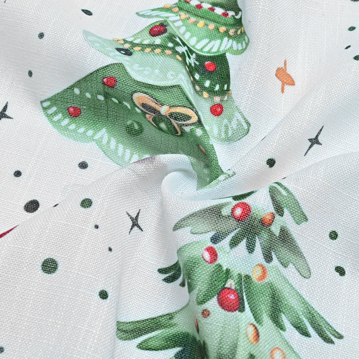 Polyester curtain with green Christmas Forest Punching pattern, shown hanging as a window treatment.