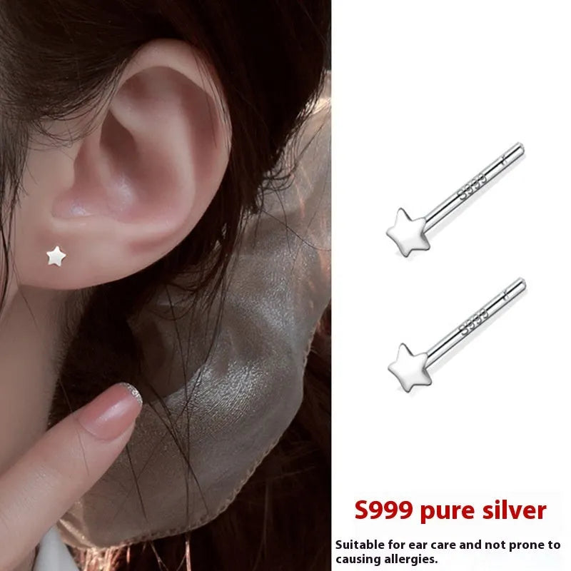 999 pure silver anti-blocking ear studs in butterfly shape on white background