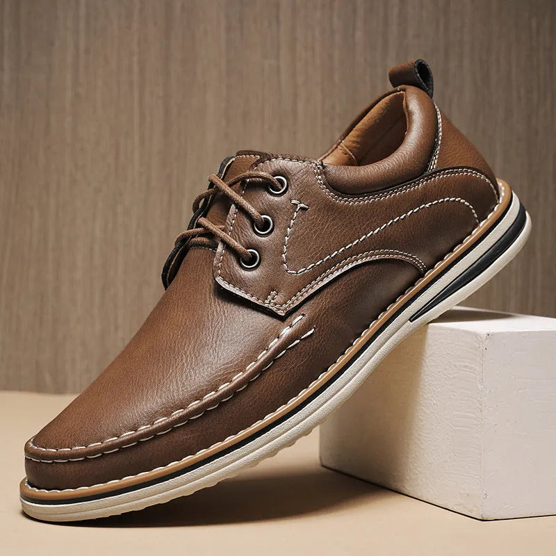 Men's genuine leather casual shoes in black with round toe and lace-up design on rubber sole