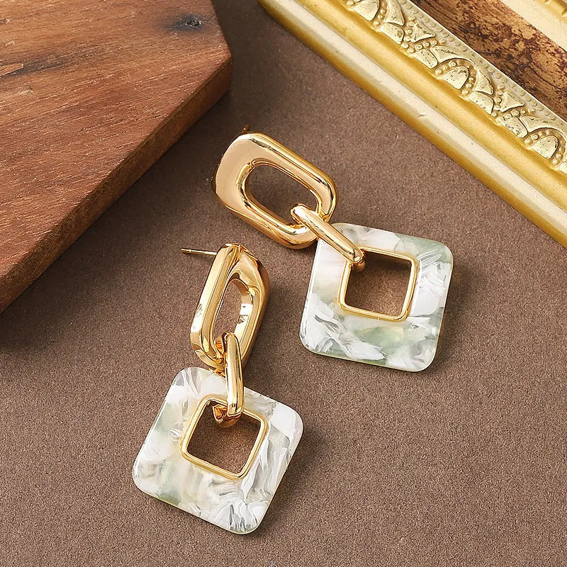 Copper hollow geometric square earrings with chamfered corners in gold or blue electroplated finish