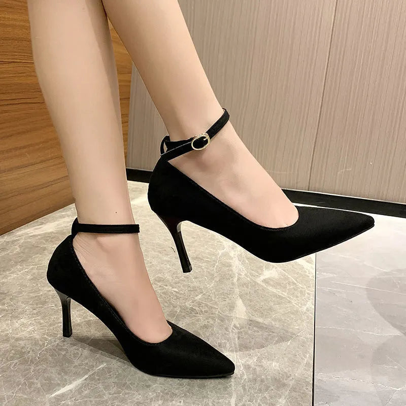 Women's black and creamy white stiletto heel shoes with buckle detail for graduation photos