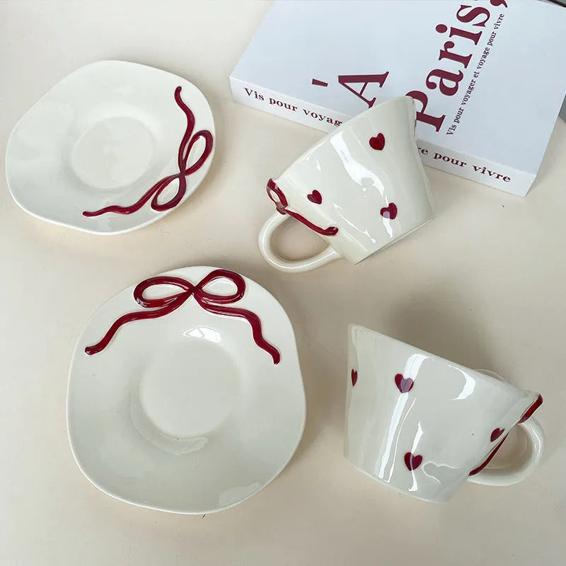 Hand painted ceramic coffee cup and saucer set in Cherry colour, irregular shape, white porcelain, 301-400ml capacity