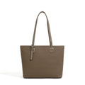 Genuine leather women's tote bag in retro style showing multiple compartments and horizontal suitcase shape