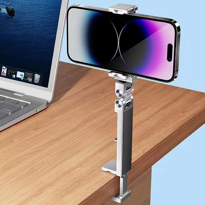 Silver aluminium alloy portable foldable clip lazy phone holder on a desk