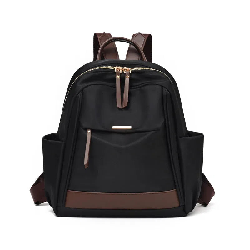 Women's large-capacity nylon travel backpack in black or milk tea colour with polyester lining and internal patch pocket.