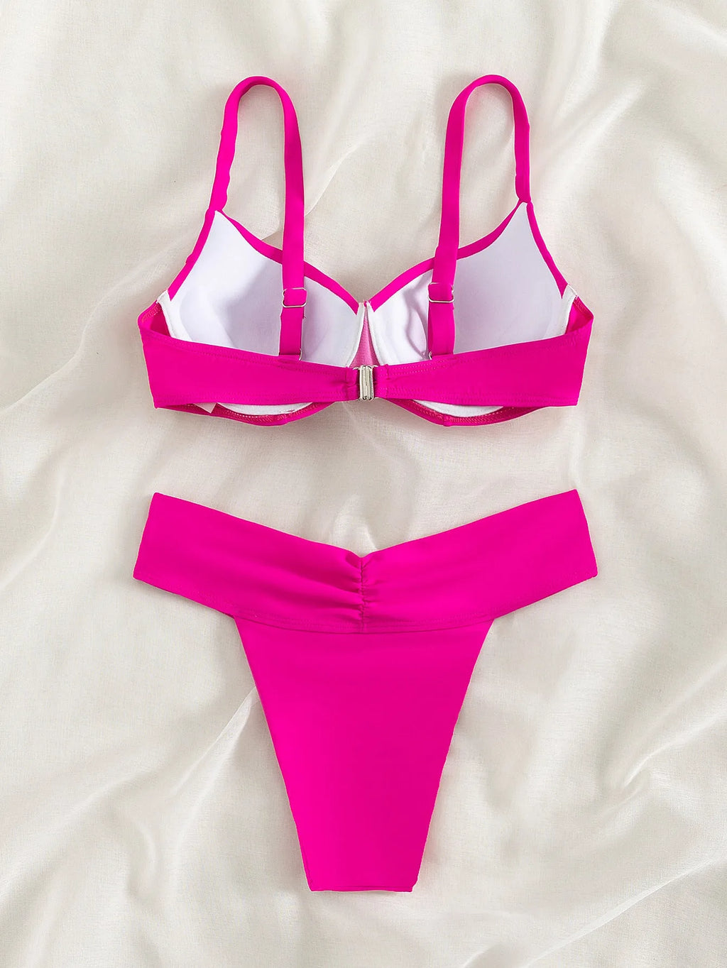 Solid colour bikini swimsuit in nylon fabric shown in fluorescent pink, green, blue, orange, and black colour options.