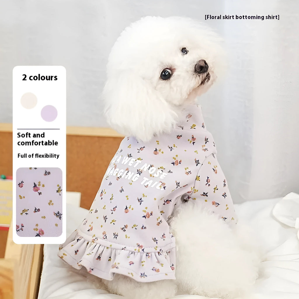 Light purple floral undershirt on a small bichon dog, showing the skirt style and fit.