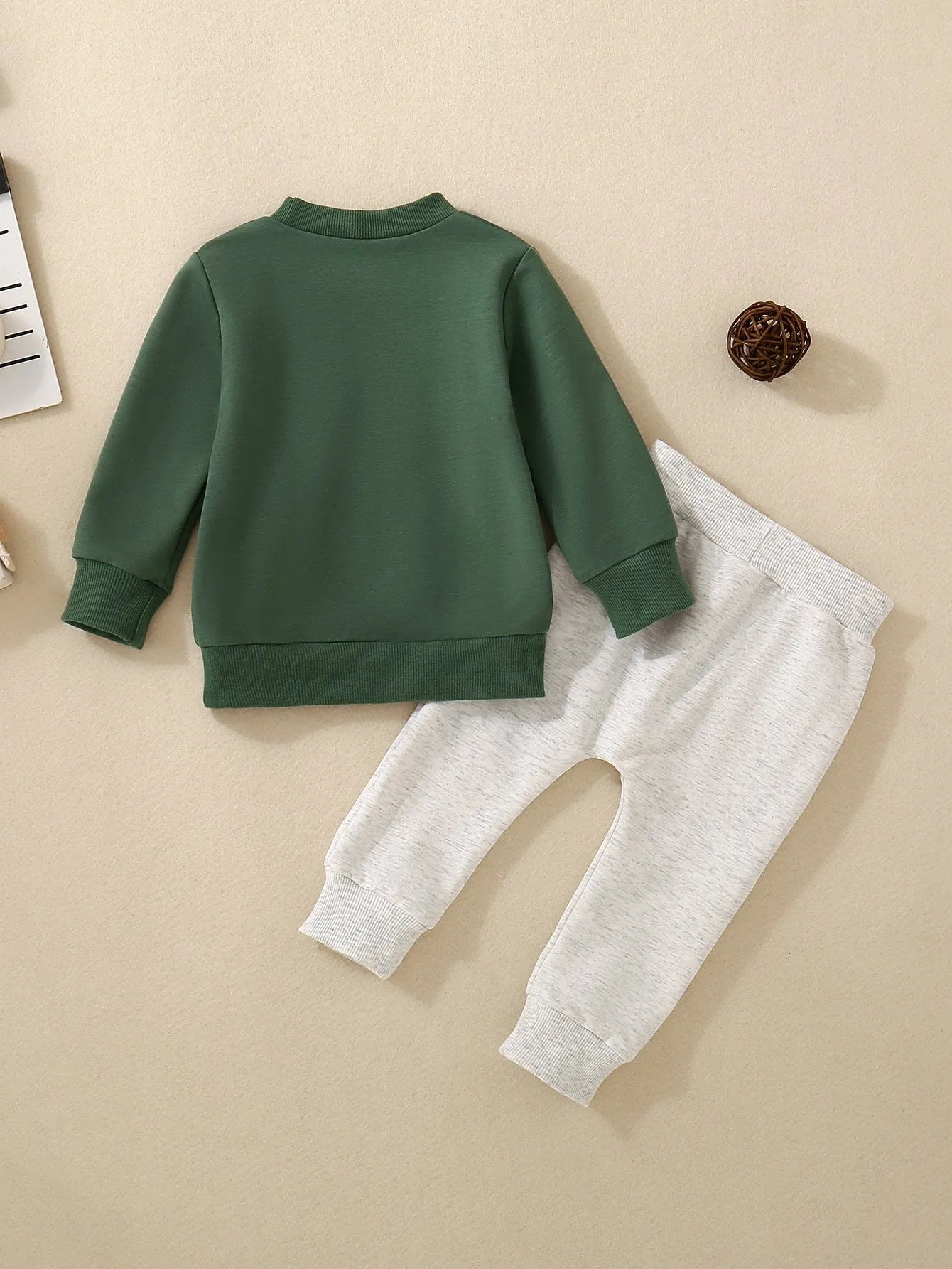 Boys and girls cotton letter sweater suit in dark green with long sleeves and matching pants on a baby
