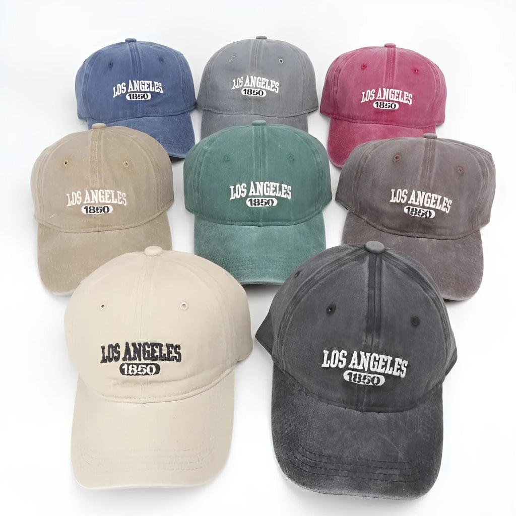 Retro personalised washed distressed peaked cap with adjustable strap and embroidered letters on the front.