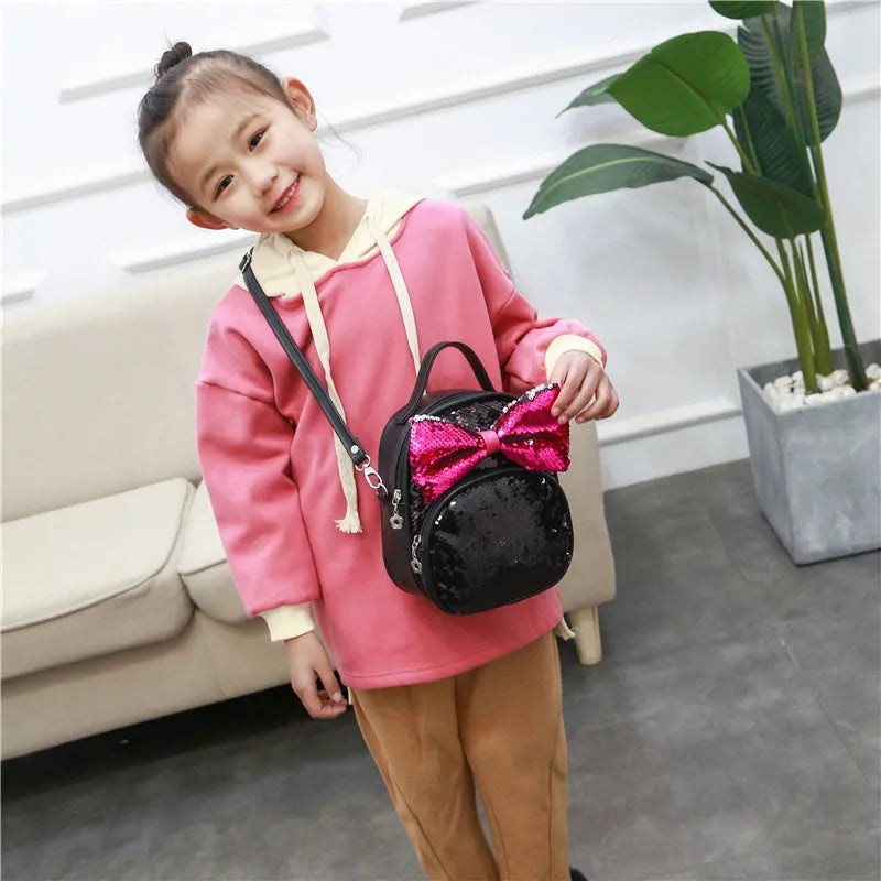 Children's sequined cartoon backpack with bow pattern, padded shoulder strap and soft carry handle, 18x9x21cm.