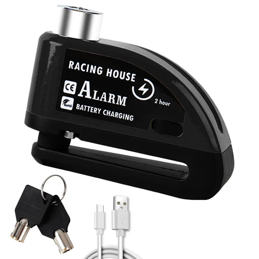 Black metal bicycle disc brake lock with red alarm button and warning cable rope on a bike disc brake