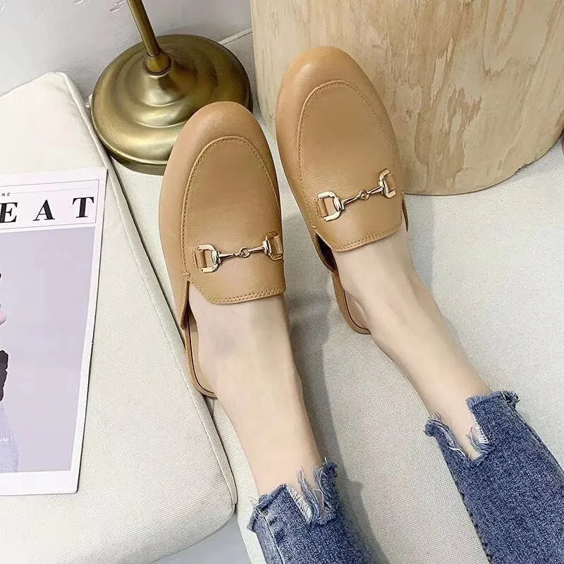 Women's closed toe PVC half slipper in milky white with a double buckle fastening.