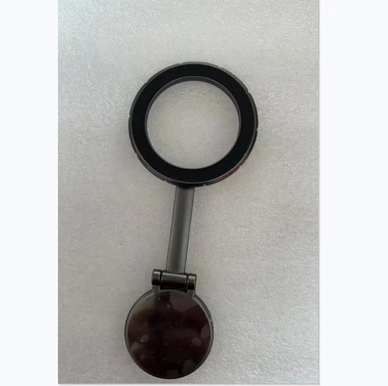 All-metal magnetic car phone mount in Qian colour on a car dashboard.