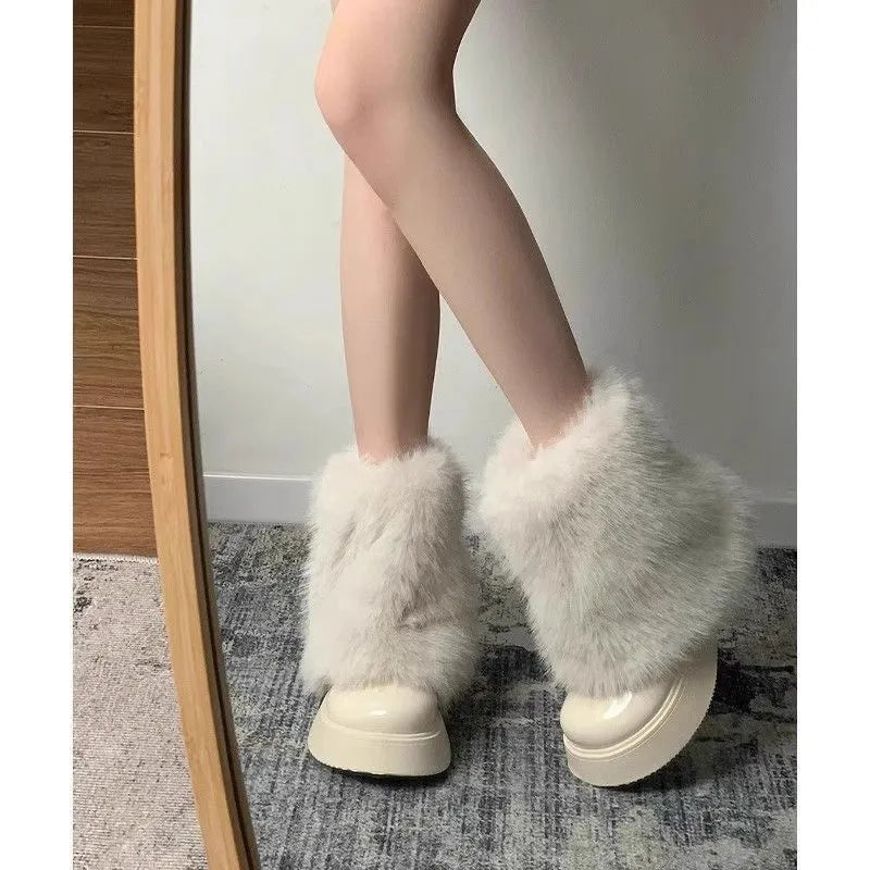 Women's black artificial plush snow boots with a waterproof rubber sole and round toe design.