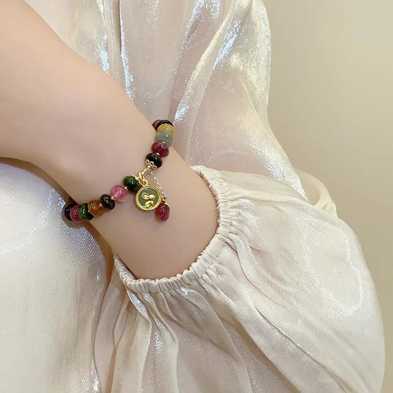 Natural stone abacus bead bracelet with a colourful tourmaline rabbit pendant.