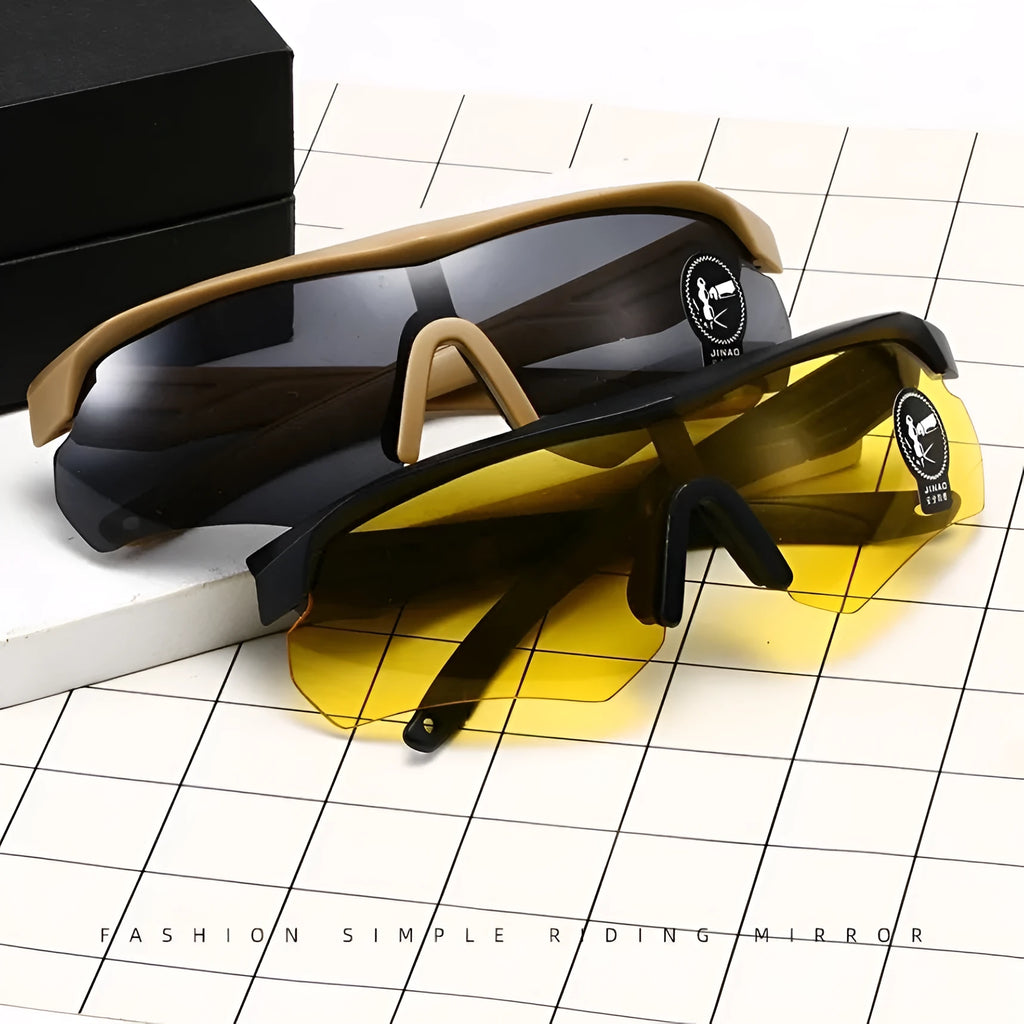 Sports goggles for cycling with polycarbonate frame and interchangeable lenses in windproof design