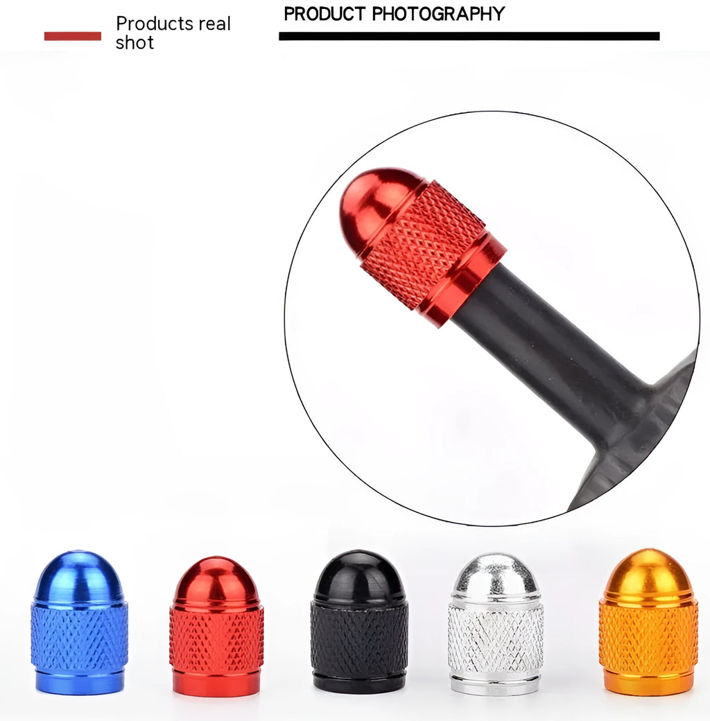 Aluminium alloy mountain bike tyre valve cap in assorted colours on a bicycle wheel.