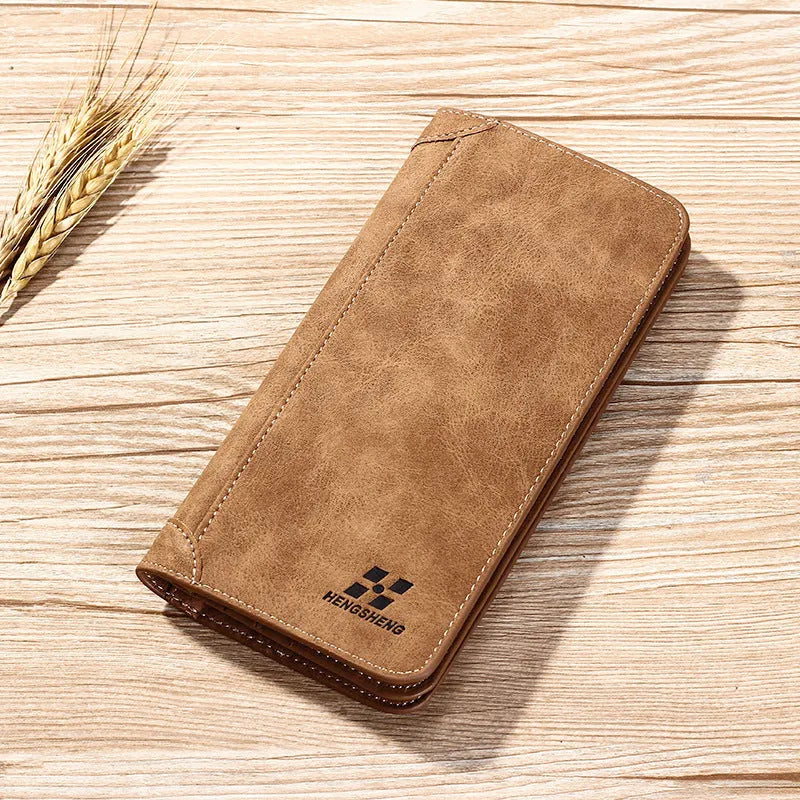 Long men's bi-fold PU leather wallet in brown with car suture stitching, open showing card slots and bill holder