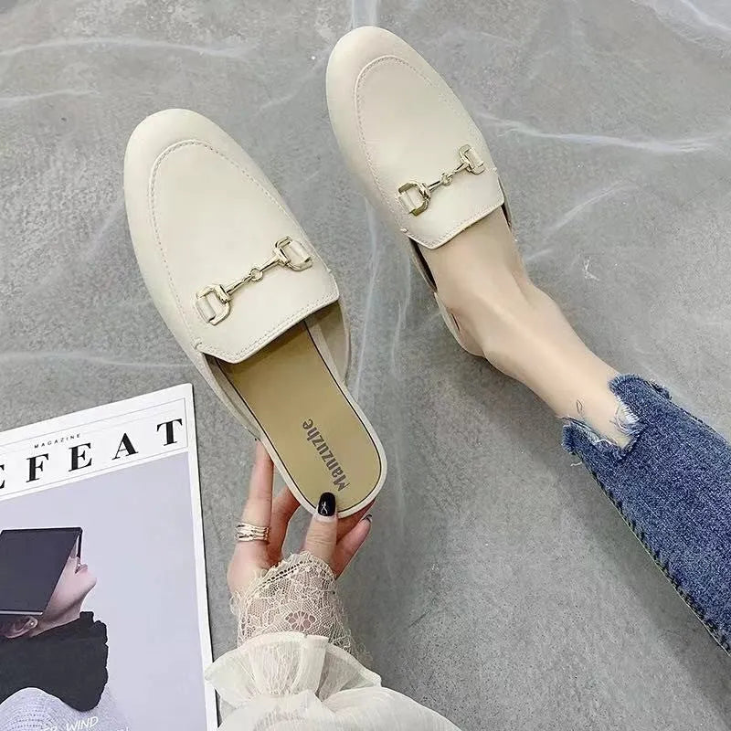 Women's closed toe PVC half slipper in milky white with a double buckle fastening.