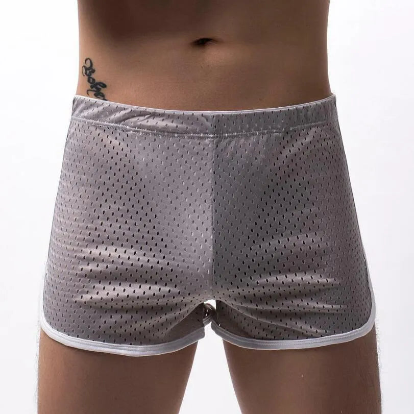 Men's solid-colour three-point boxer shorts laid flat, showing mid-waist band and three-point fly design.