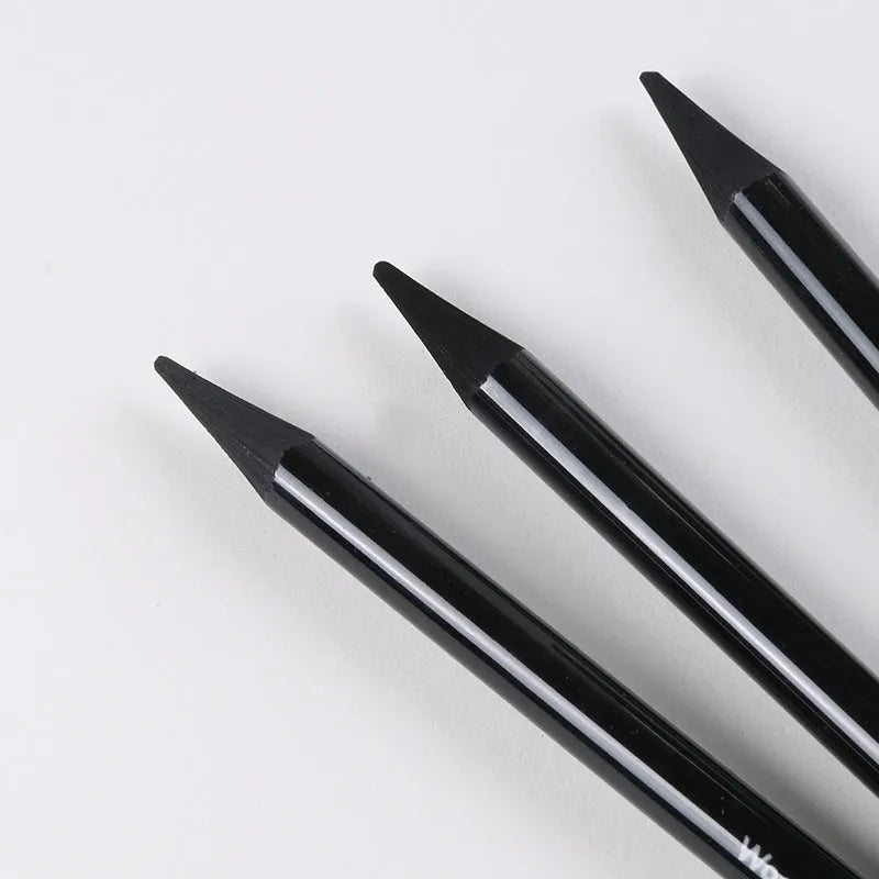 Set of six graphite and three carbonized pencils with wooden casings on a retail suction card.