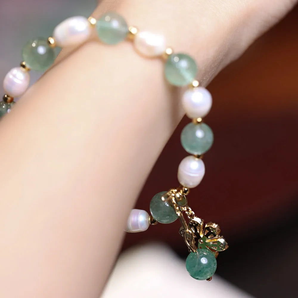 Green freshwater pearl bracelet with geometric strawberry beads and Chinese knot closure