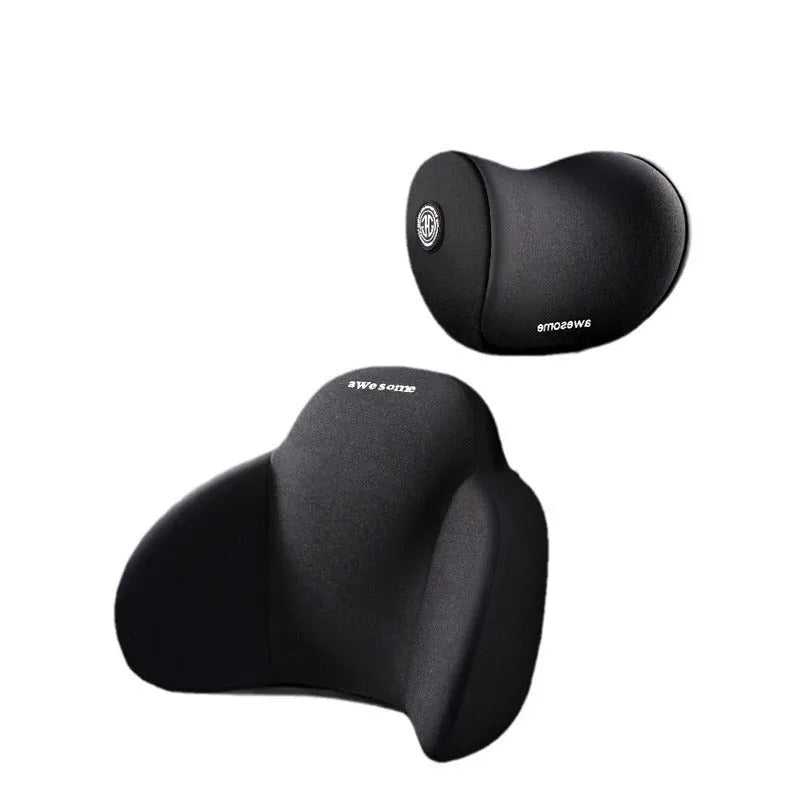 Black memory foam triangle lumbar support pillow and headrest on a car seat.