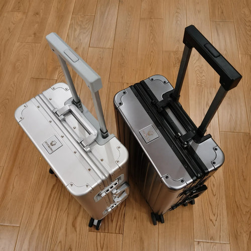 Aluminium magnesium alloy striped luggage suitcase in metallic blue colour showing hard-shell construction