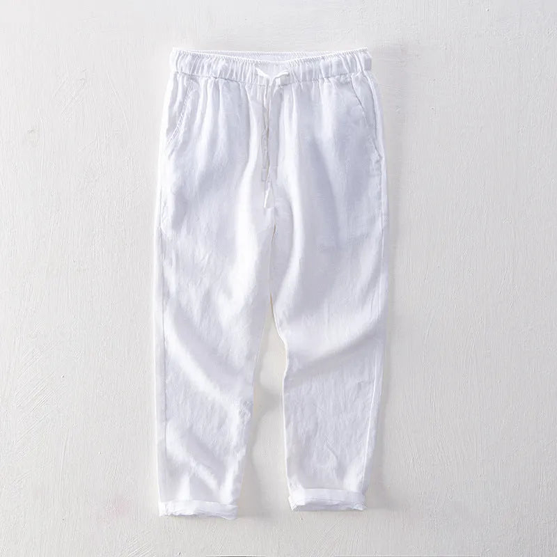 Men's straight leg linen trousers in light grey colour showing mid waist and relaxed fit