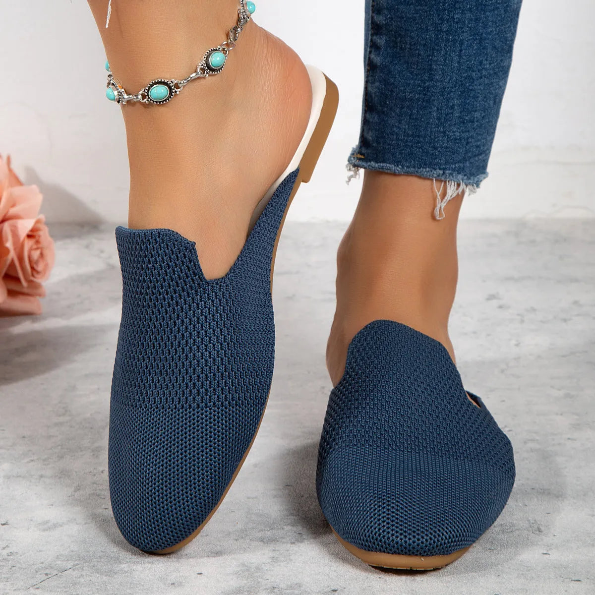 Mesh sandals with cloth upper and rubber sole in apricot colour, showing round toe slip-on design