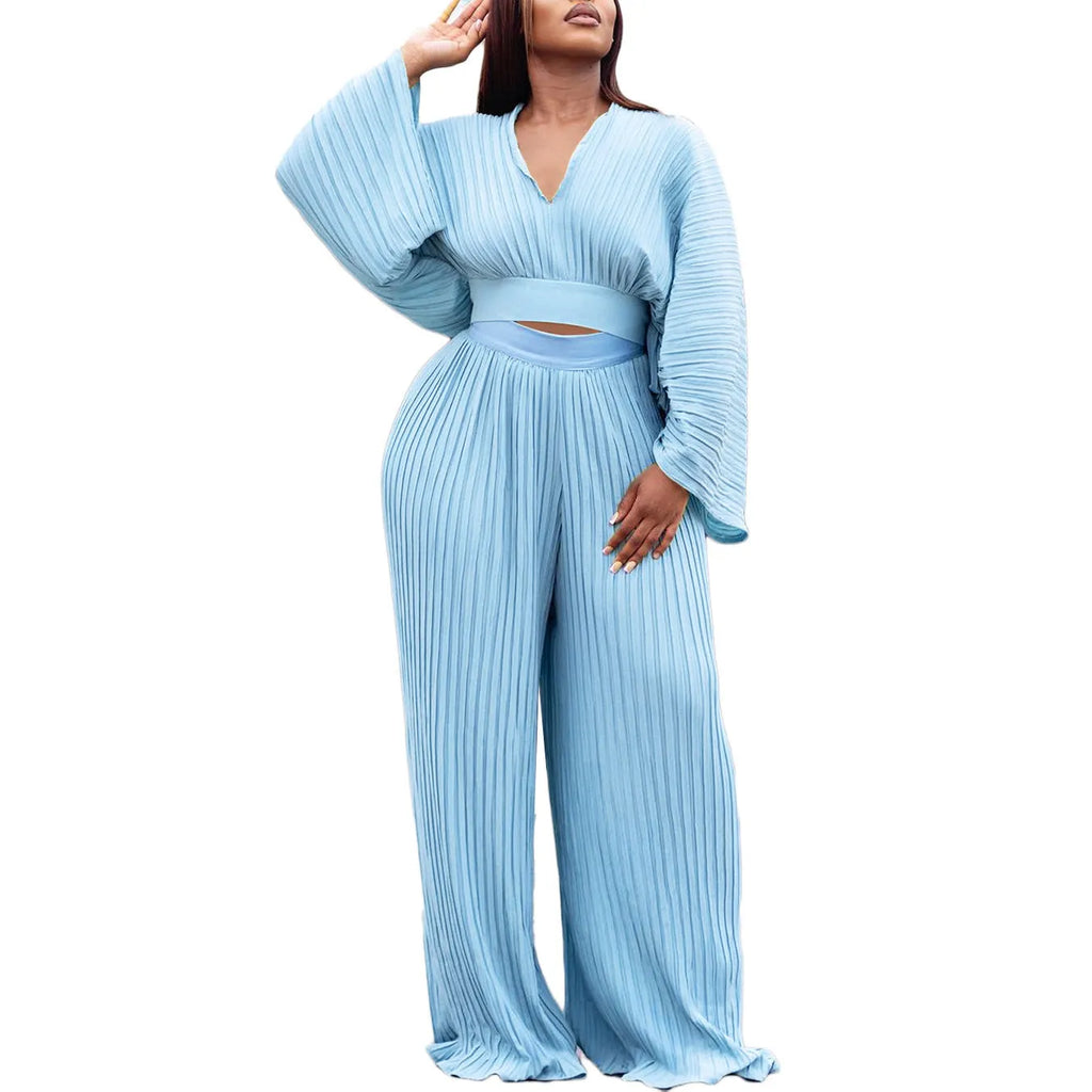 Women's African print two-piece suit set with batwing sleeve blouse and wide leg trousers in red.