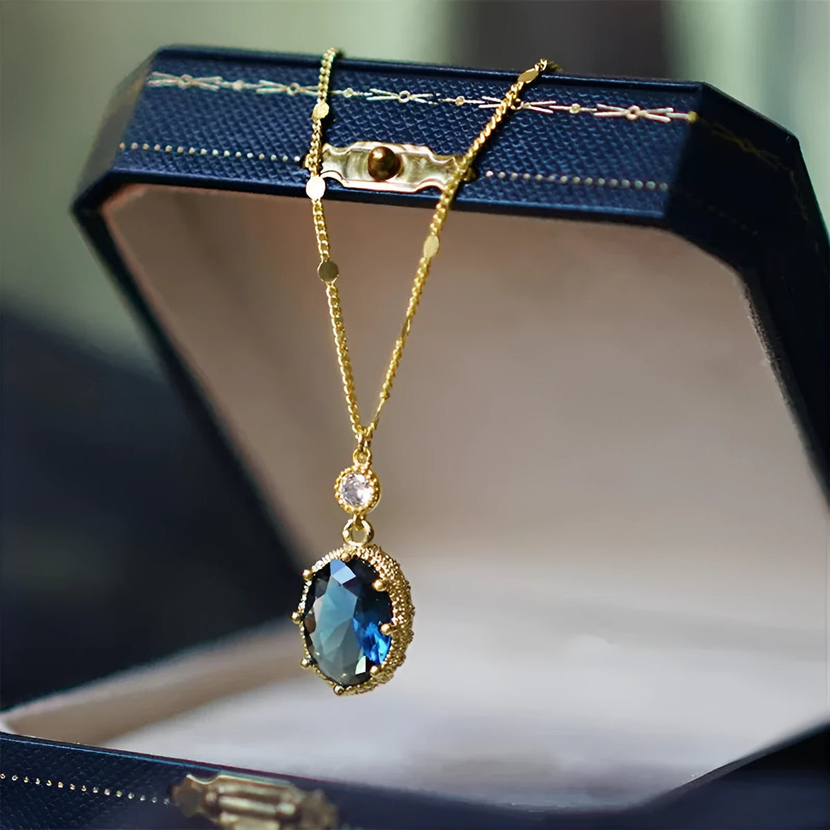 Gold electroplated copper geometric pendant necklace with a French retro unisex design
