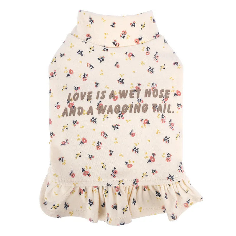 Light purple floral undershirt on a small bichon dog, showing the skirt style and fit.