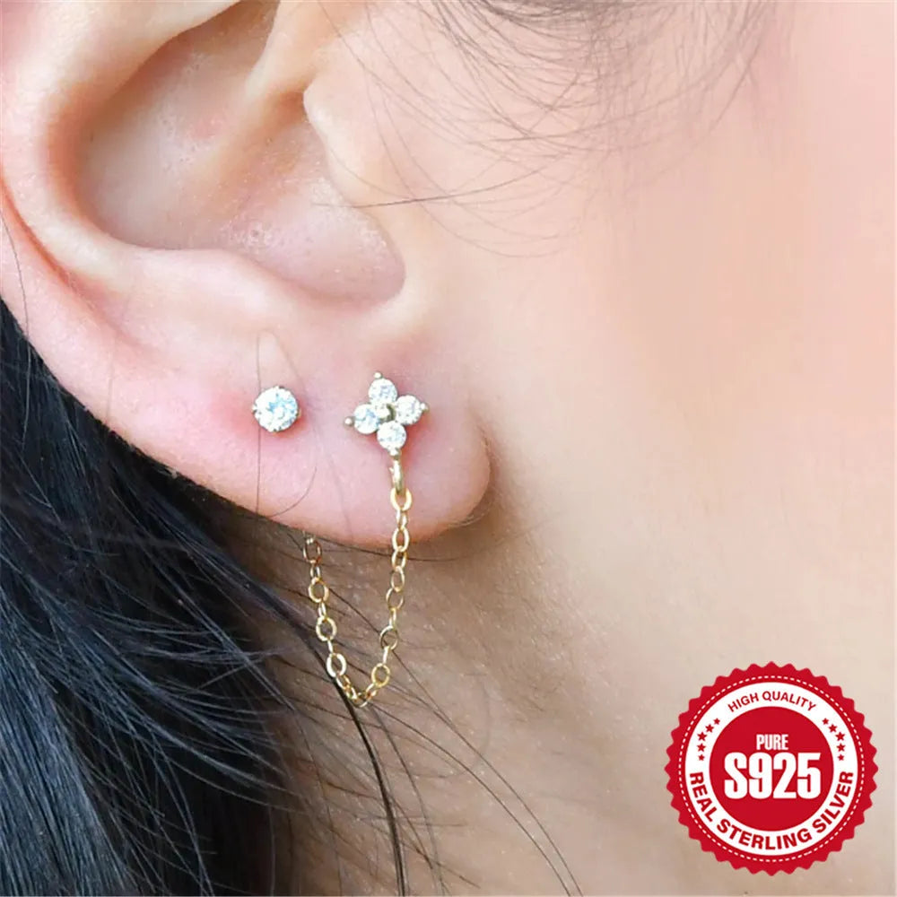 S925 sterling silver ear studs with geometric flower design and tassel chain elements in golden colour